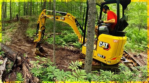 clearing trails with mini excavator|trail building machine tools.